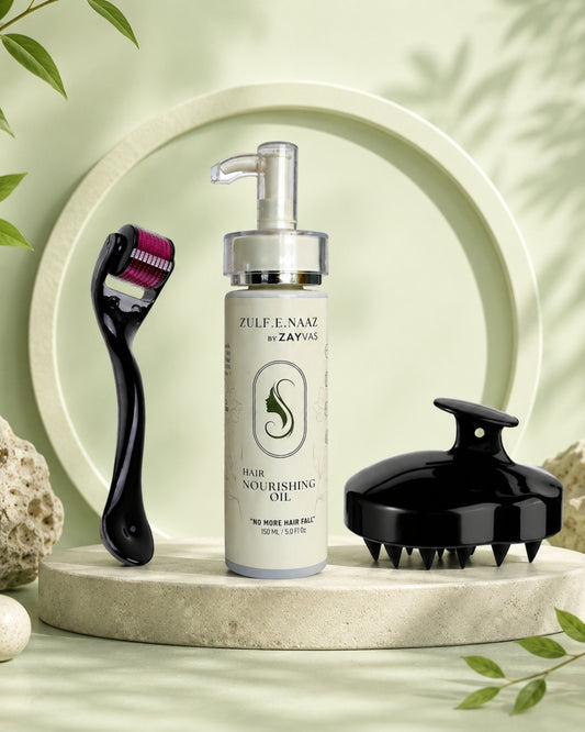 Hair care product with scalp massager and hair removal tool on a decorative stand with green leaves.